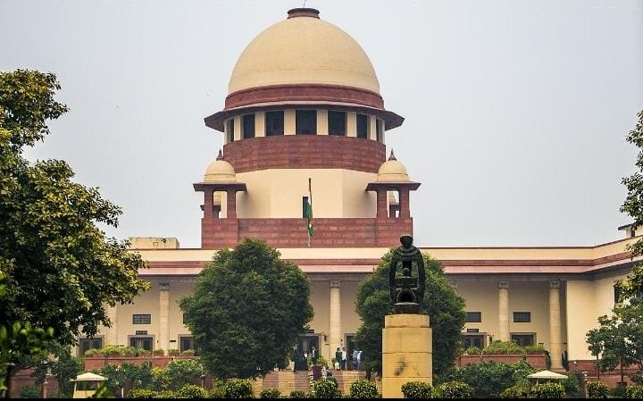 Supreme Court Issues Directions on Delhi Protests: What People Need to Know New Delhi, October 12, 2026: The Supreme Court of India issued directions on October 11 concerning restrictions and public movement in Delhi amid protests in the national capital. The directions addressed the treatment of peaceful protesters, the functioning of public transport and internet services, and the need to review barricading arrangements. According to reports published by News On AIR and other news organisations, the Court emphasised that peaceful gatherings should not lead to unlawful detention and that people's movement should not be unnecessarily obstructed. The directions remain subject to applicable laws, traffic regulations and legitimate law-and-order requirements. What Did the Supreme Court Say? The Court's directions focused on maintaining public access and ensuring that restrictions are applied in accordance with the law. Among the issues addressed were the following: - Peaceful gatherings: Authorities were directed to ensure that people participating peacefully are not illegally detained. - Public movement: The Court emphasised that the movement of people should remain unhindered, subject to traffic rules and applicable restrictions. - Metro and train services: The Court called for normal functioning of services in line with the prevailing law-and-order situation. - Internet services: The directions addressed the need to avoid unnecessary disruption of internet services, subject to the law. - Barricading arrangements: Authorities were asked to review arrangements affecting movement in the capital. These directions came amid concerns about restrictions imposed around protests and the operation of public services in Delhi. Why Did the Matter Reach the Supreme Court? The hearing followed concerns over restrictions connected with planned protests in the capital. A plea sought action over alleged non-compliance with earlier directions concerning public transport and movement. During the proceedings, the Court heard submissions from the parties and addressed the need to balance the right to peaceful assembly with public order and the smooth functioning of essential services. The proceedings also involved questions about the circumstances in which restrictions may be imposed. The Court's directions should be understood in the context of the specific matter before it rather than as a blanket removal of every restriction. What Does This Mean for Delhi Residents? For residents, commuters and people travelling through Delhi, the directions highlight the importance of maintaining access to public transport and allowing lawful movement. However, commuters should not assume that every route, station or area will necessarily be free of restrictions at all times. Local traffic arrangements and security measures may still apply depending on the situation. People planning to travel should check official Delhi Metro, traffic police and other relevant advisories before leaving. Protest participants should also follow applicable laws and directions issued by competent authorities. Does the Order Mean All Restrictions Have Been Removed? Not necessarily. The Court's directions are subject to applicable law and law-and-order considerations. The practical effect of the directions depends on how the authorities implement them and on any further proceedings or orders. Readers should distinguish between the Court's reported directions and claims circulating on social media that may overstate their effect. For the most accurate interpretation, the Court's official order and subsequent proceedings should be consulted when available. What Happens Next? The matter may involve further submissions and consideration by the Court. Any additional directions, clarification or implementation updates should be checked against reliable reporting and official court records. For now, the key point is that the Supreme Court has stressed lawful treatment of peaceful protesters and the need to avoid unnecessary disruption to public movement and essential services. Sources - News On AIR: Supreme Court directions on peaceful protesters and public movement. - Indian Express: Report on the Supreme Court hearing concerning protests and restrictions in Delhi. Supreme Court of India building in New Delhi